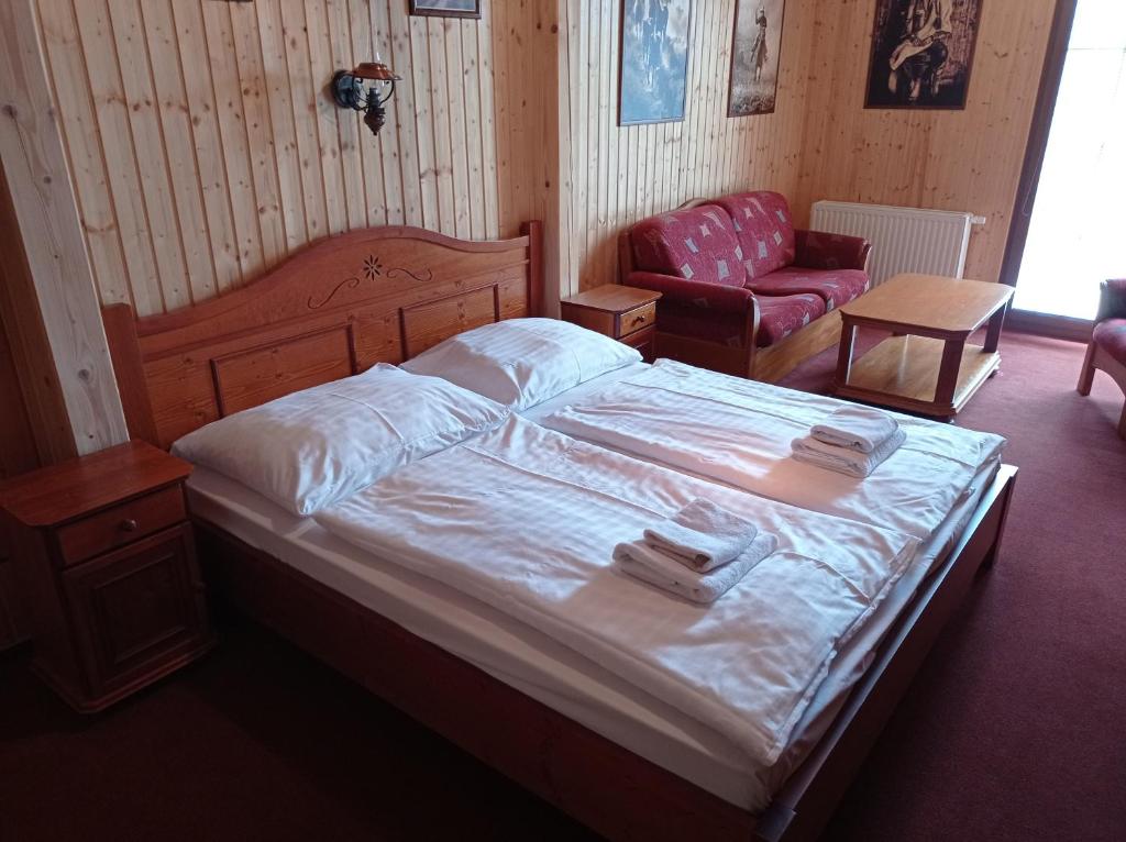 Postel nebo postele na pokoji v ubytování Ranč Kostelany