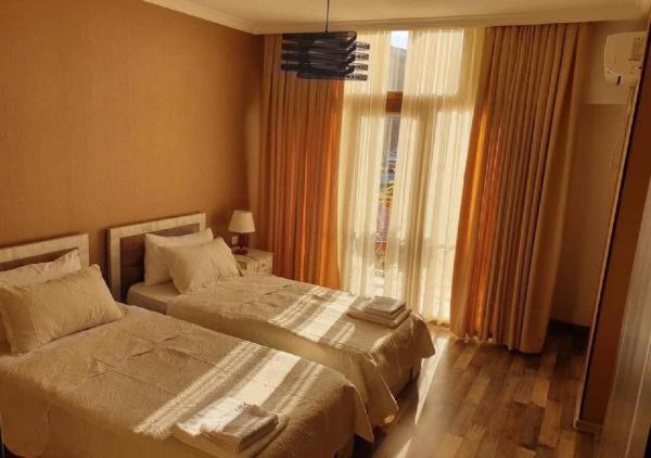 Postel nebo postele na pokoji v ubytování Hotel Dimasi