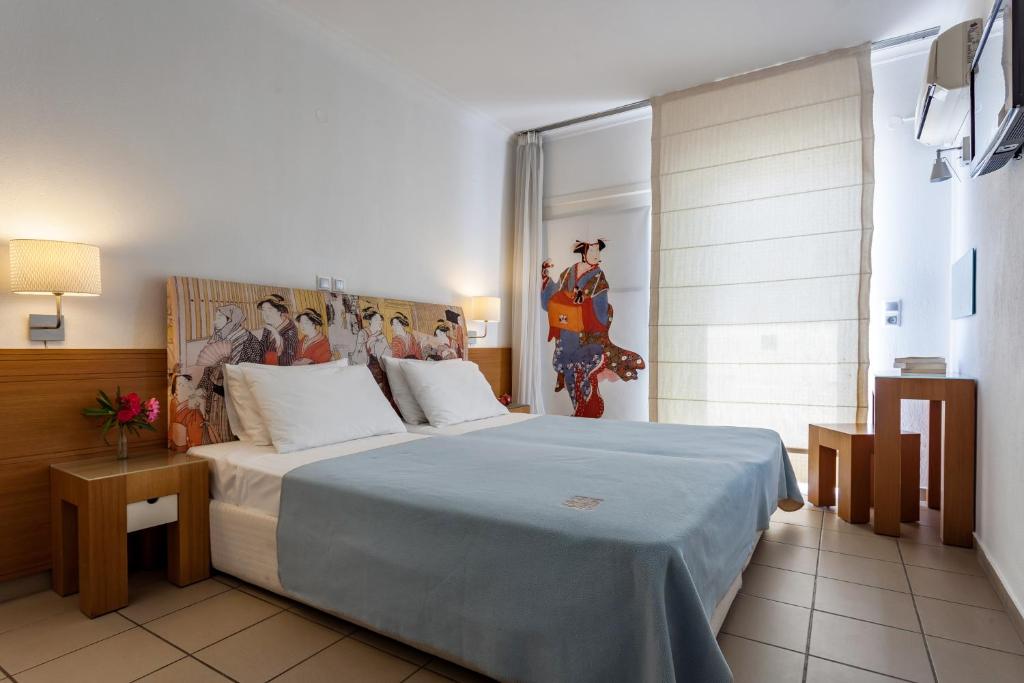 Postel nebo postele na pokoji v ubytování Hotel Akti