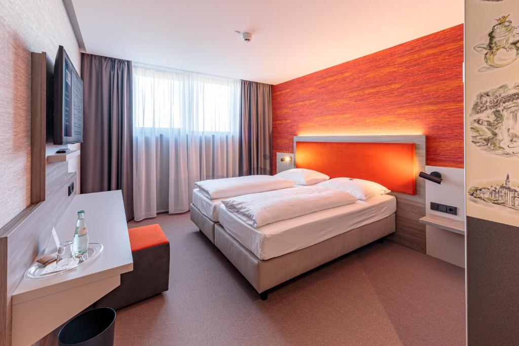 Postel nebo postele na pokoji v ubytování Hotel am Rüssel