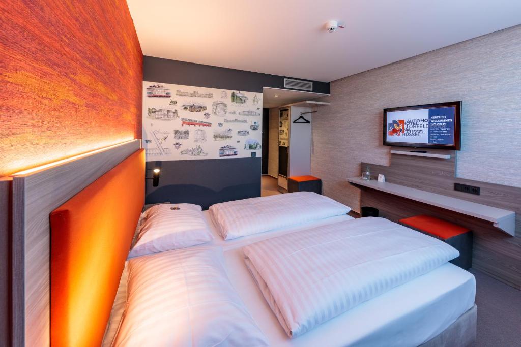 Postel nebo postele na pokoji v ubytování Hotel am Rüssel