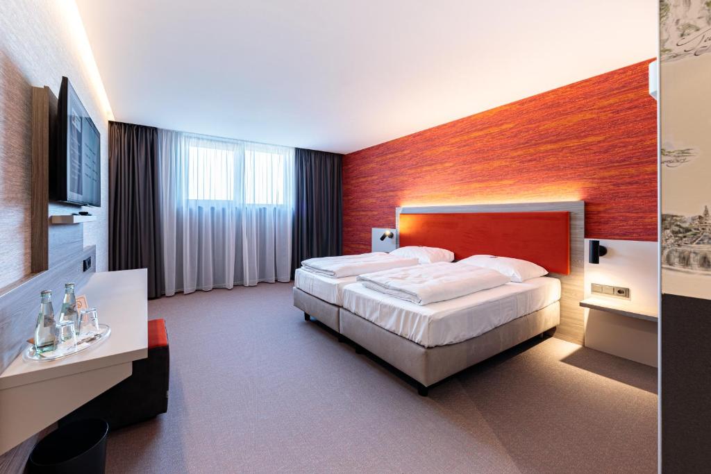 Postel nebo postele na pokoji v ubytování Hotel am Rüssel