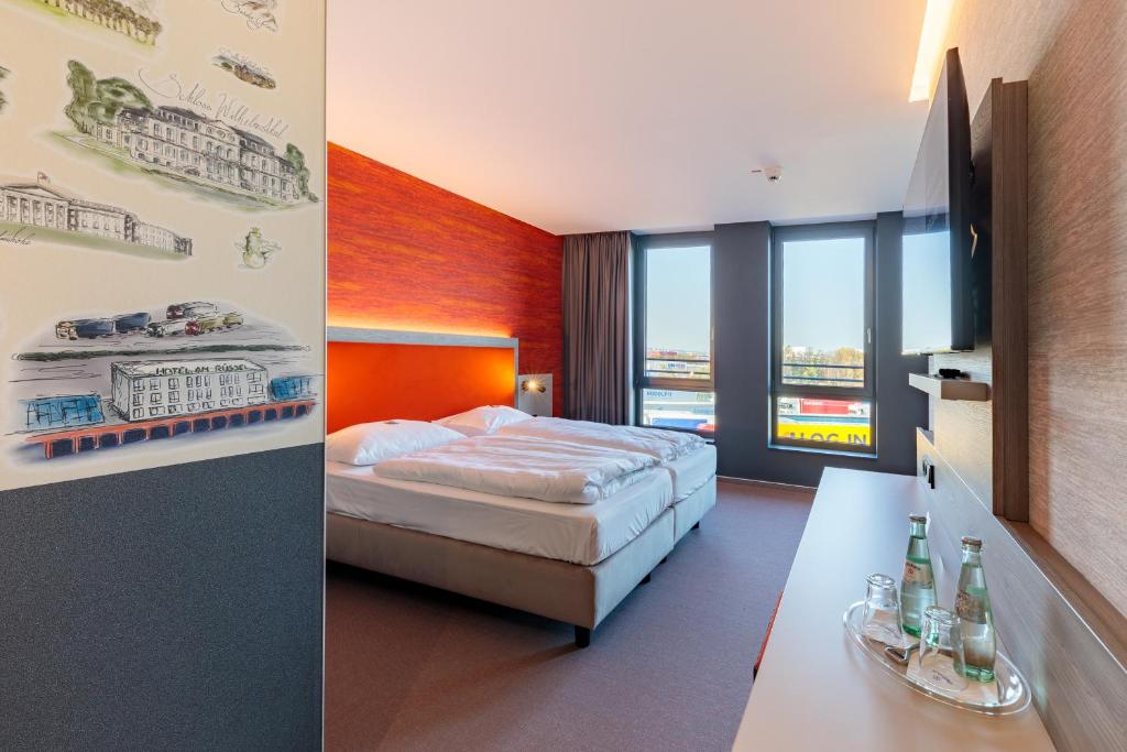 Postel nebo postele na pokoji v ubytování Hotel am Rüssel