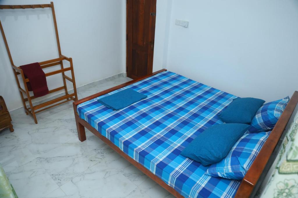 Postel nebo postele na pokoji v ubytování FOREST VIEW HOME STAY