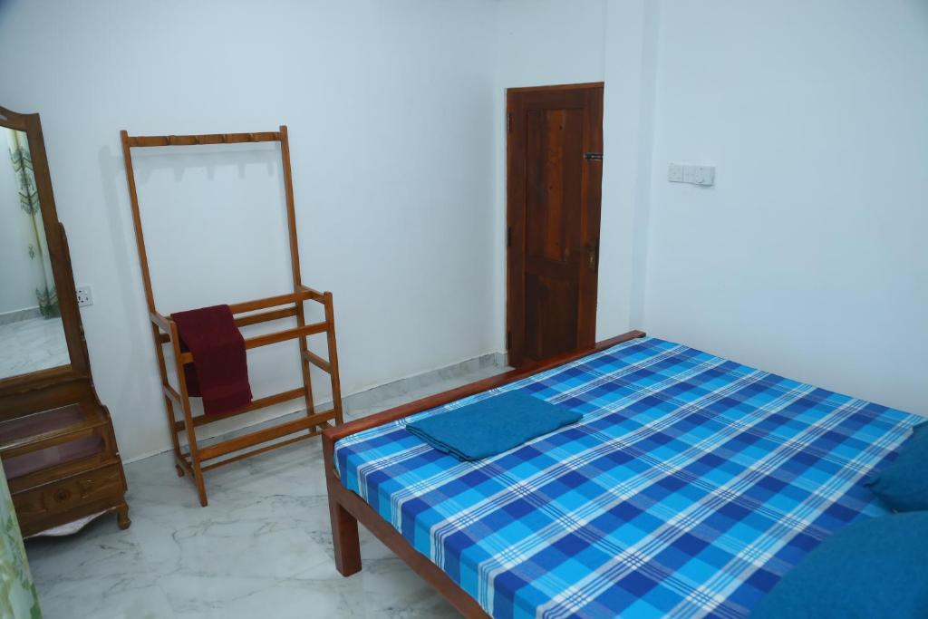 Postel nebo postele na pokoji v ubytování FOREST VIEW HOME STAY