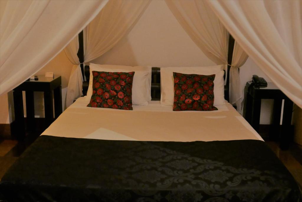 Postel nebo postele na pokoji v ubytování Aram Yamí Boutique Hotel