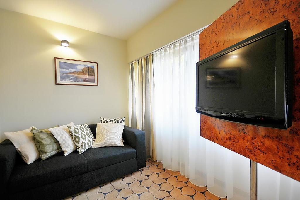 Televízia a/alebo spoločenská miestnosť v ubytovaní 209 w ROYAL TULIP SAND przy plaży DOBRUK APARTAMENTY