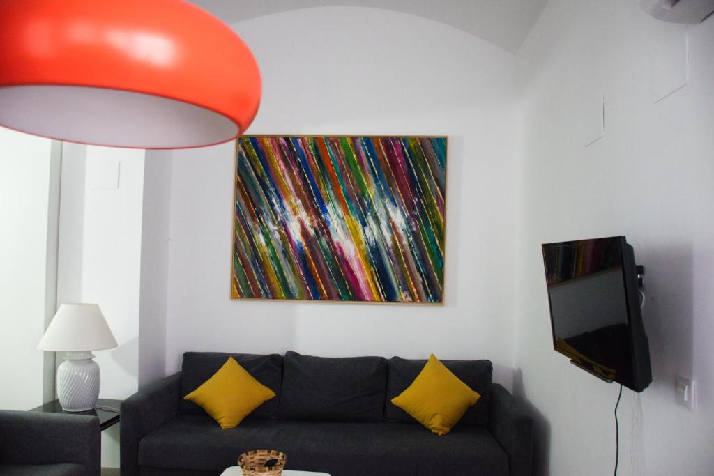 TV a/nebo společenská místnost v ubytování Covadonga 9 Apartments - Triana