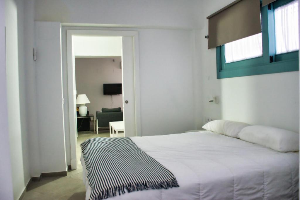 Postel nebo postele na pokoji v ubytování Covadonga 9 Apartments - Triana