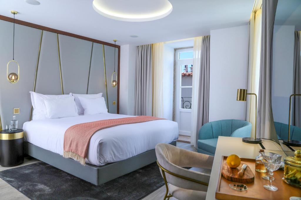 Uma cama ou camas num quarto em São Vicente Alfama Hotel by TRIUS Hotels