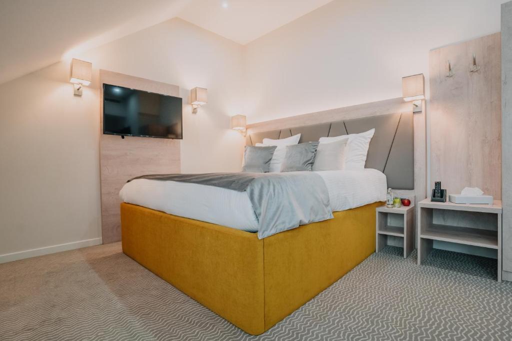 Postel nebo postele na pokoji v ubytování Hôtel Concorde