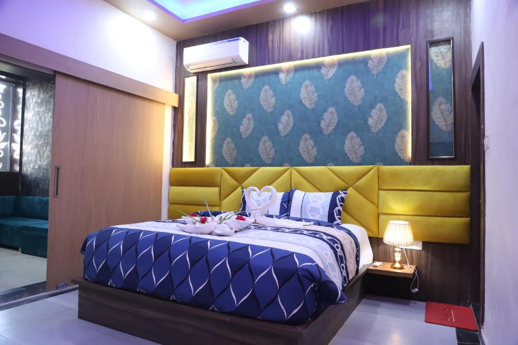 Ένα ή περισσότερα κρεβάτια σε δωμάτιο στο SRG INN HOTEL