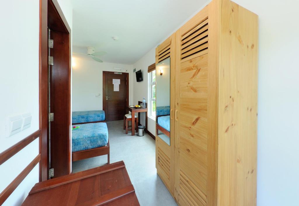 Postel nebo postele na pokoji v ubytování Antares Dhangethi & Spa