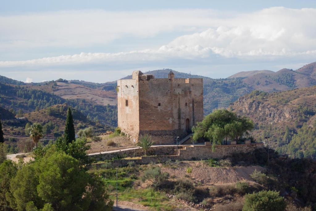 an old castle on top of a mountain at Apartment Vista del Castillo in Vélez de Benaudalla