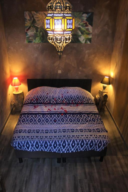 Postel nebo postele na pokoji v ubytování B&B 't Zwaluwnest