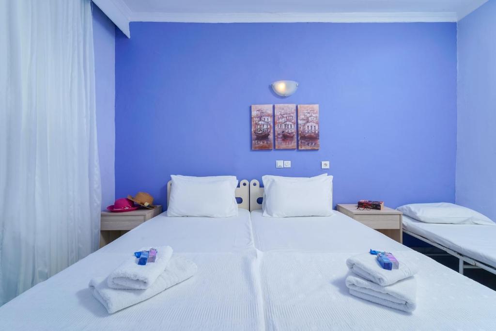 Postel nebo postele na pokoji v ubytování Eleani Hotel