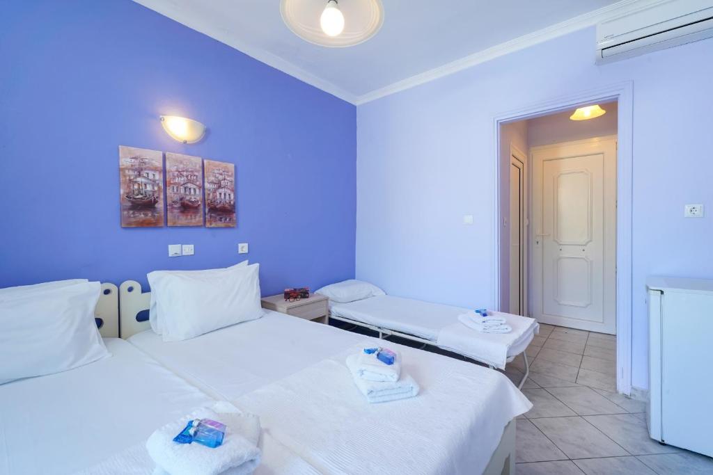 Postel nebo postele na pokoji v ubytování Eleani Hotel