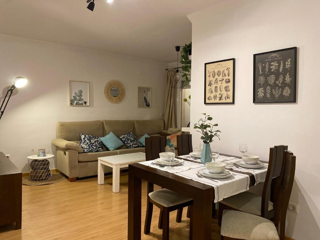 a living room with a table and a couch at Ponte Canedo in Ourense