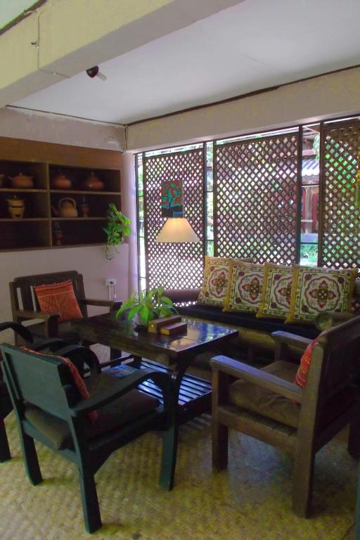 Posezení v ubytování Baantawan Guesthouse Pai