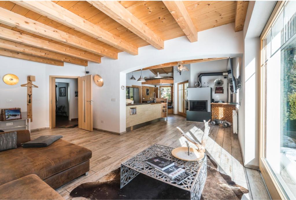 a living room with a couch and a table at Zillertal Residenz in Ginzling