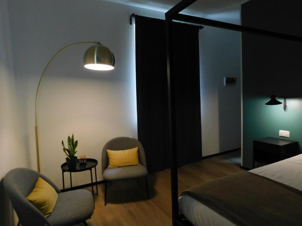 Postel nebo postele na pokoji v ubytování Piumaviola Beds & Apartments
