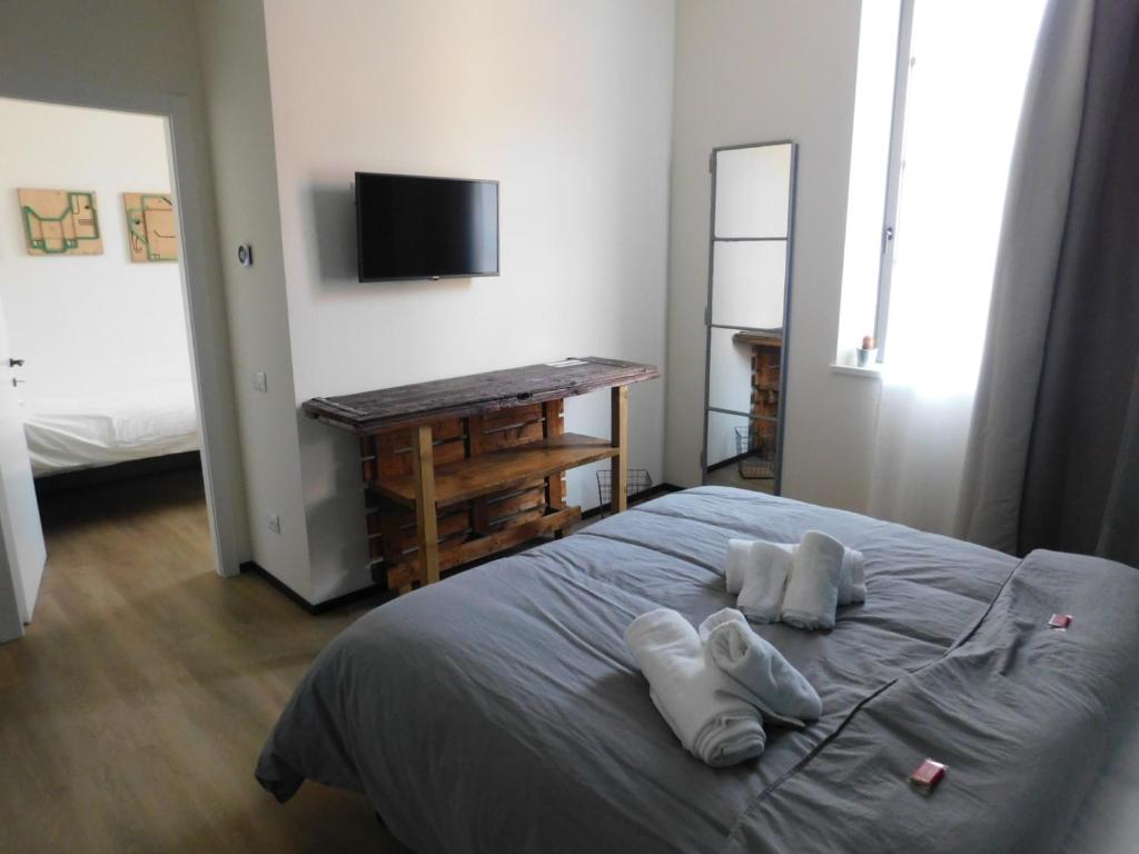 Postel nebo postele na pokoji v ubytování Piumaviola Beds & Apartments
