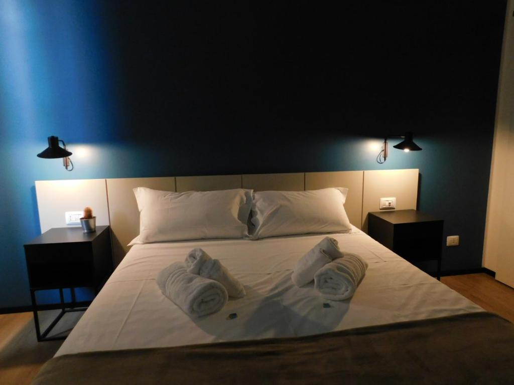 Postel nebo postele na pokoji v ubytování Piumaviola Beds & Apartments