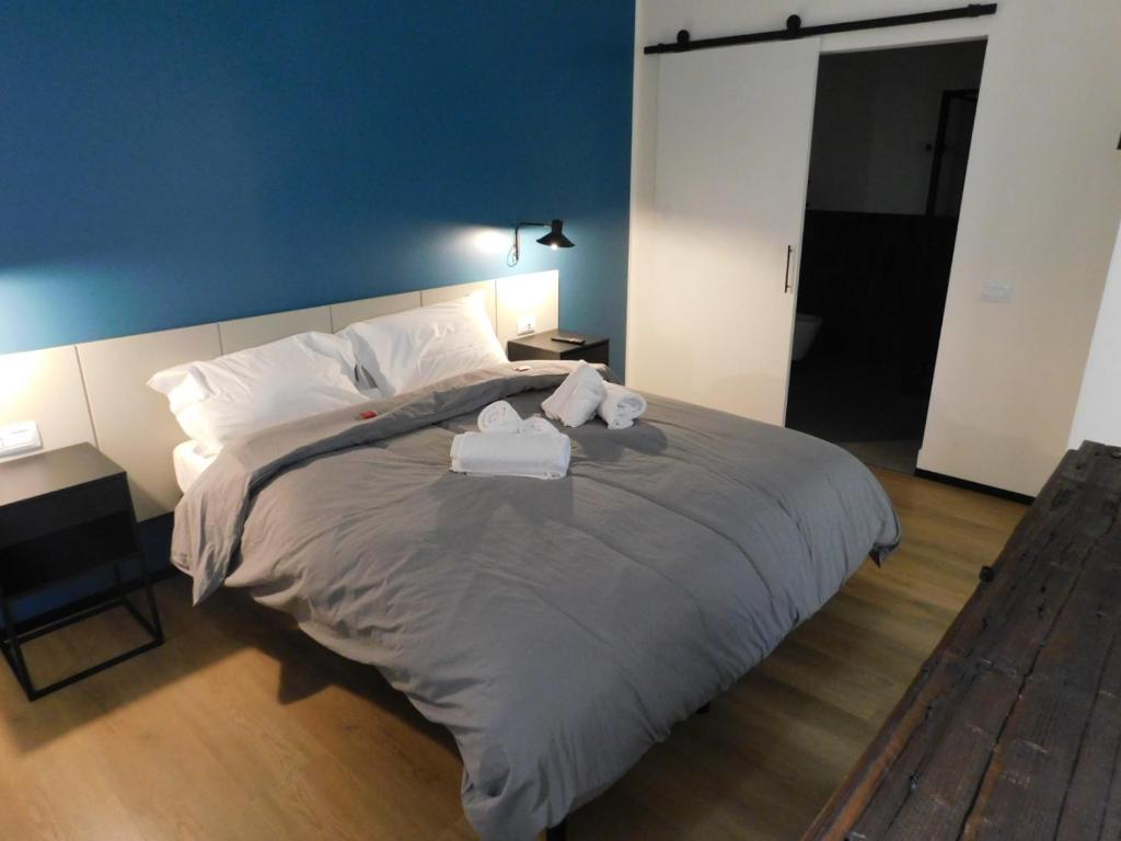 Postel nebo postele na pokoji v ubytování Piumaviola Beds & Apartments