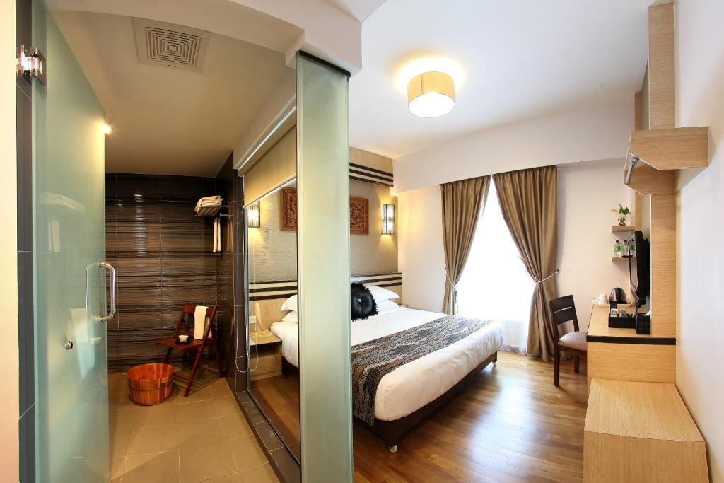 Postel nebo postele na pokoji v ubytování Hotel Richbaliz Selayang