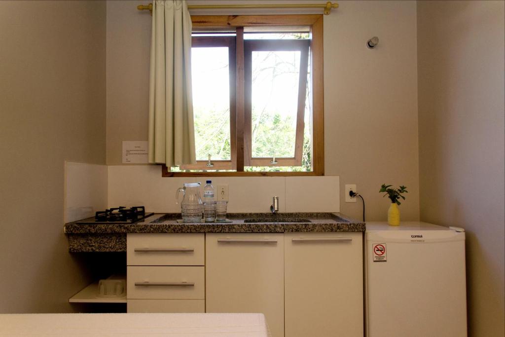Kuchyň nebo kuchyňský kout v ubytování Pousada Villa Embaú