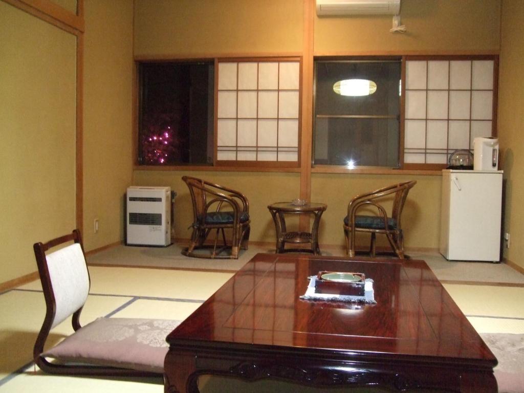 Kuchyň nebo kuchyňský kout v ubytování Marunaka Ryokan