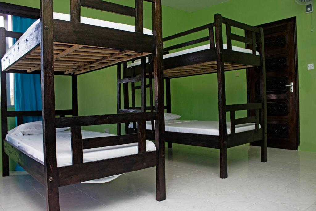 Postel nebo postele na pokoji v ubytování Tulia House Backpackers