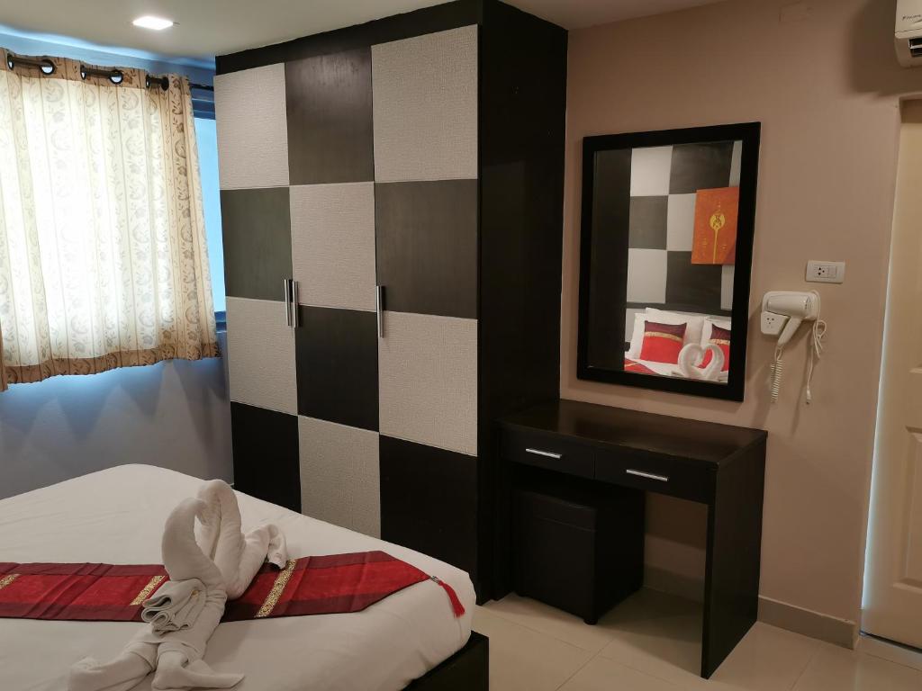 Postel nebo postele na pokoji v ubytování Regent Suvarnabhumi Hotel