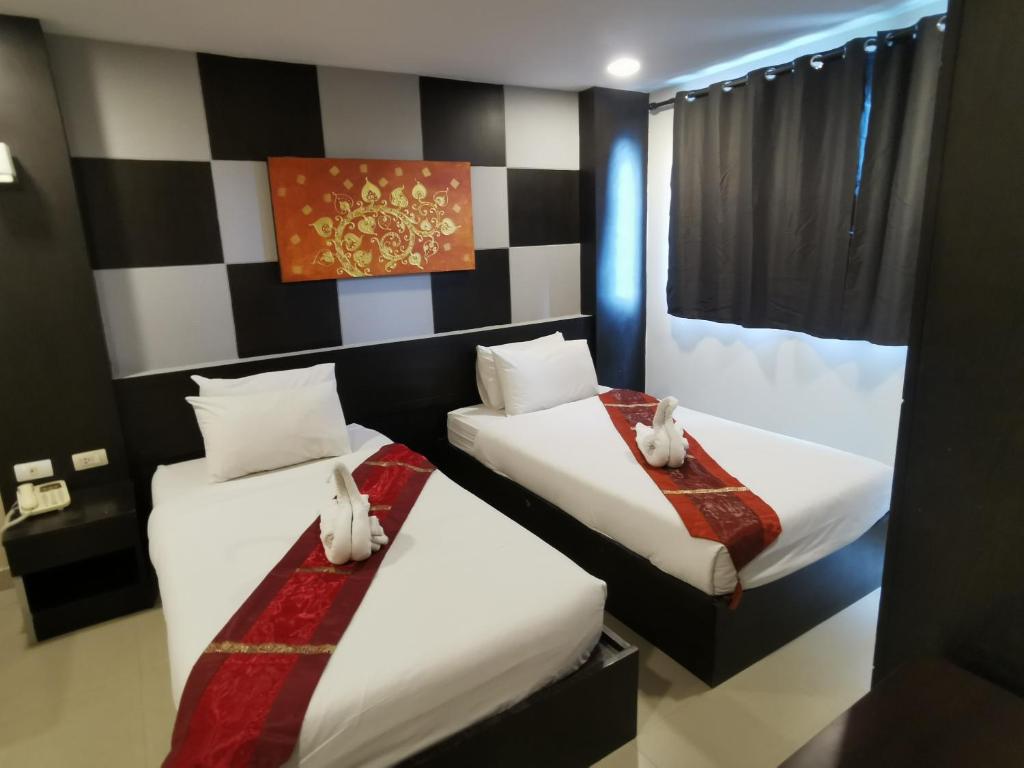 Postel nebo postele na pokoji v ubytování Regent Suvarnabhumi Hotel