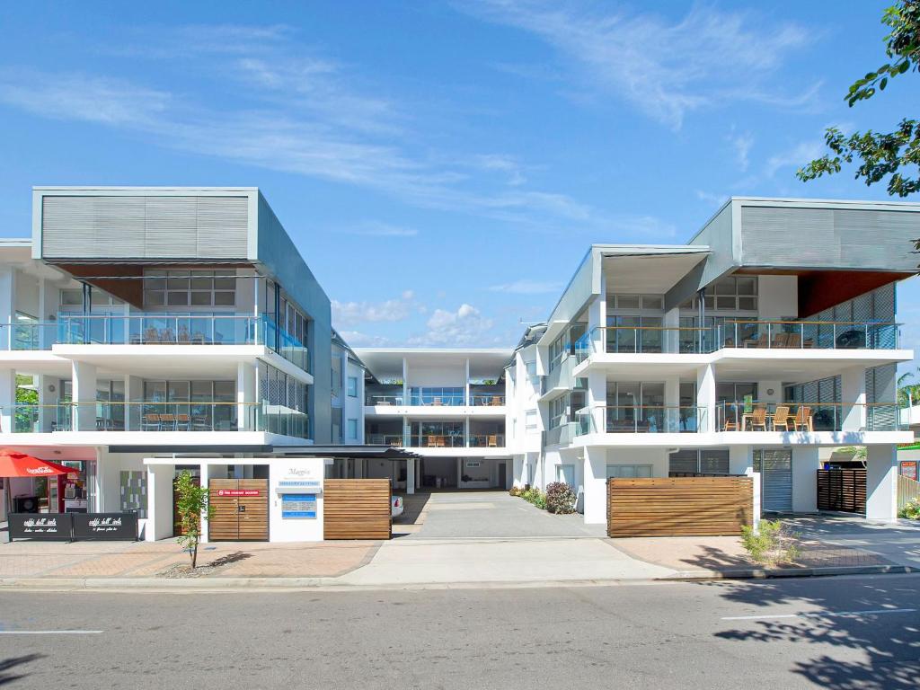 an apartment building with balconies on a street at Maggies Beachfront Apartment 2 in Horseshoe Bay