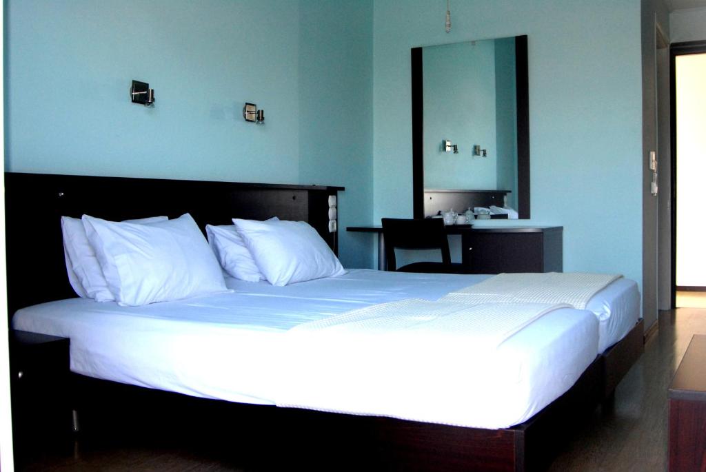 Postel nebo postele na pokoji v ubytování Hotel Georgios
