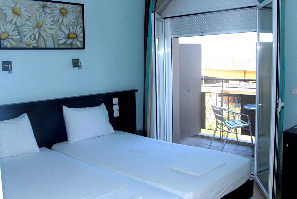 Postel nebo postele na pokoji v ubytování Hotel Georgios