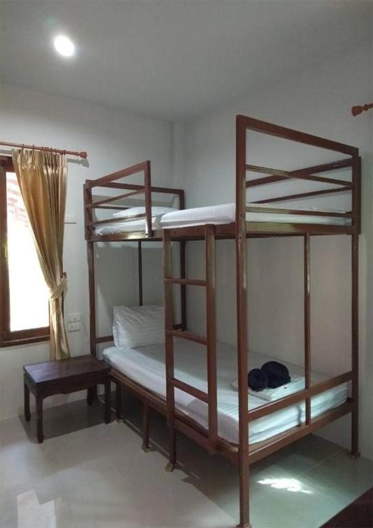 Postel nebo postele na pokoji v ubytování Lanta Cottage - SHA Plus