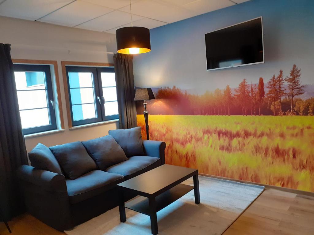 TV a/nebo společenská místnost v ubytování Hotell Greven