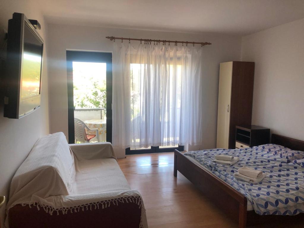 Кровать или кровати в номере Apartments Palit Rab