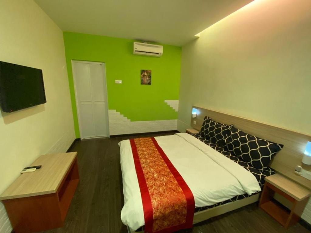 Postel nebo postele na pokoji v ubytování N&L HOTEL KUALA TERENGGANU