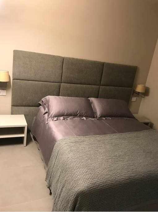 A bed or beds in a room at Orta Paradise 26