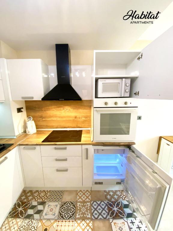 Kuchyň nebo kuchyňský kout v ubytování habitat Holiday Apartment