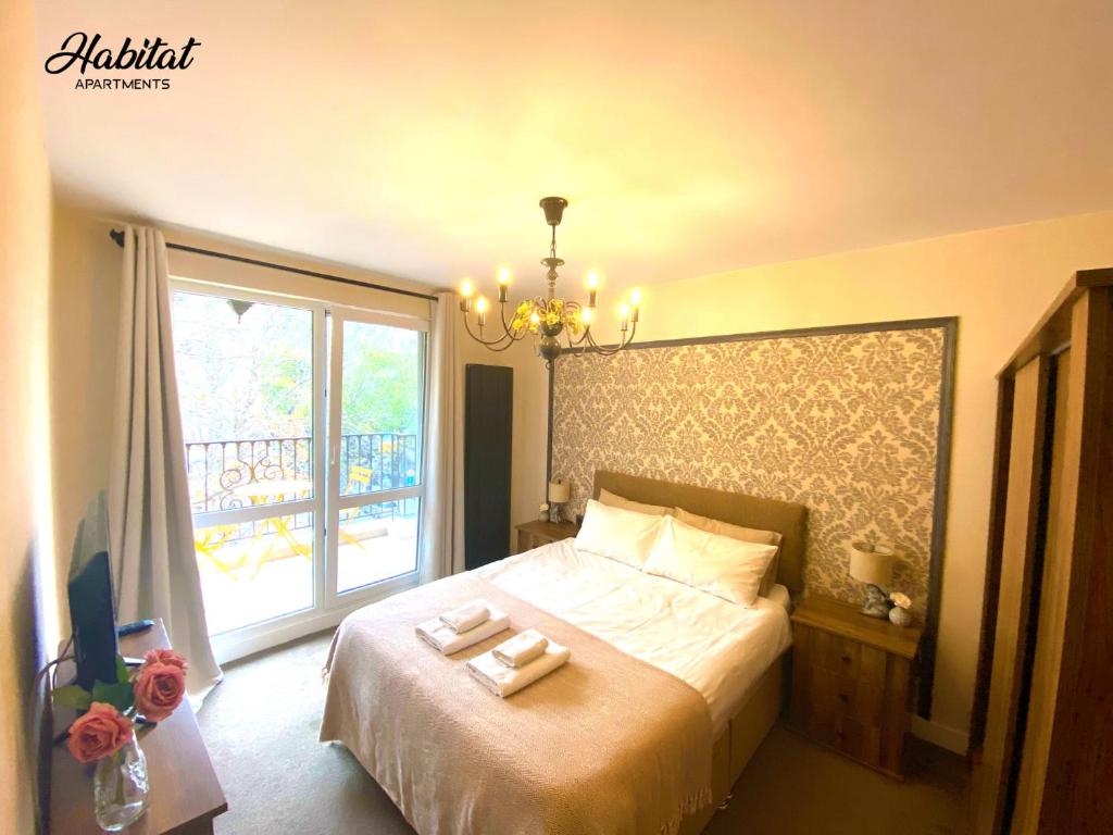 Postel nebo postele na pokoji v ubytování habitat Holiday Apartment