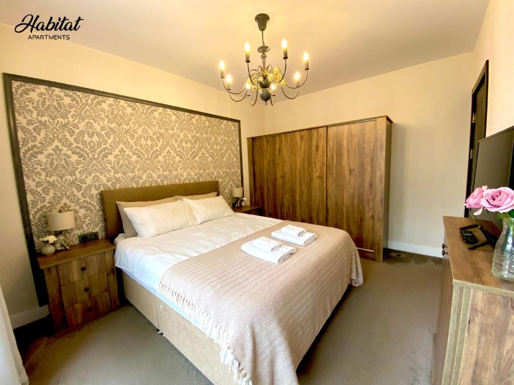 Postel nebo postele na pokoji v ubytování habitat Holiday Apartment