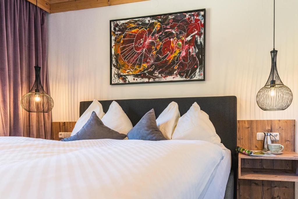 Postel nebo postele na pokoji v ubytování Hotel Der Schmittenhof