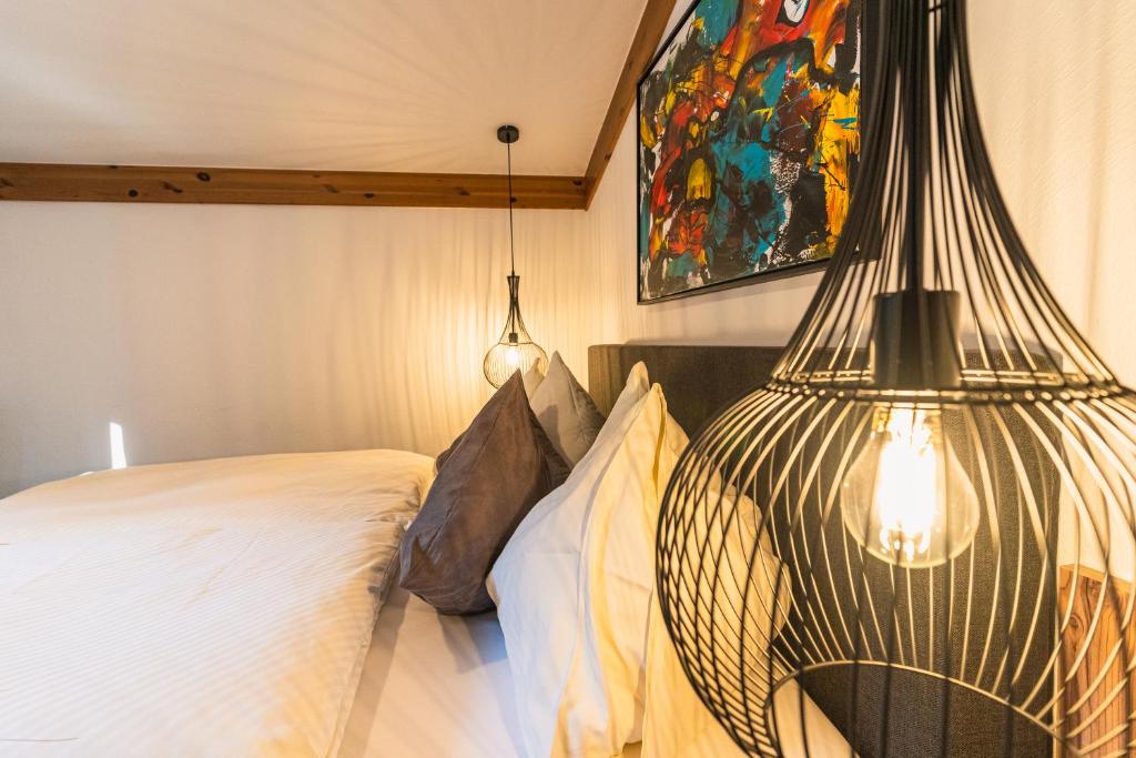 Postel nebo postele na pokoji v ubytování Hotel Der Schmittenhof