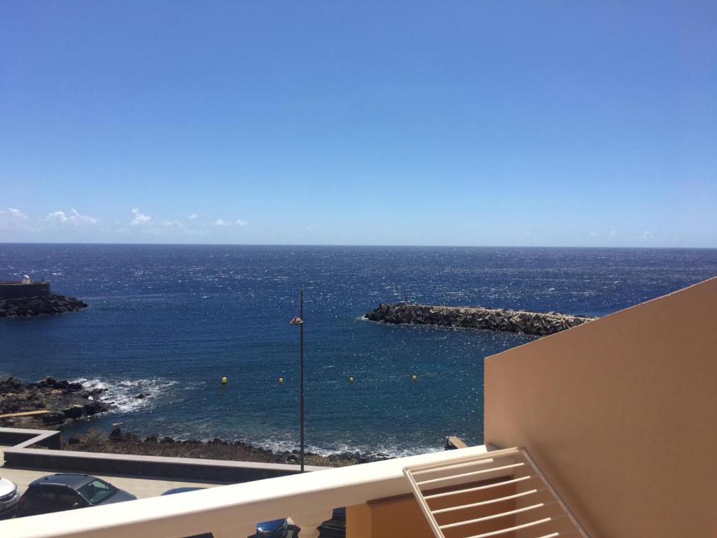 a view of the ocean from the balcony of a building at Apto Tagoro, La Restinga in La Restinga