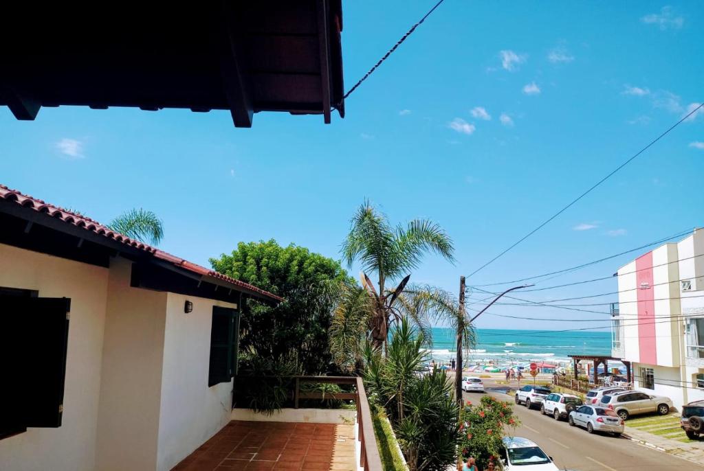 a view of the beach from a house at Pousada Morada Da Prainha in Torres