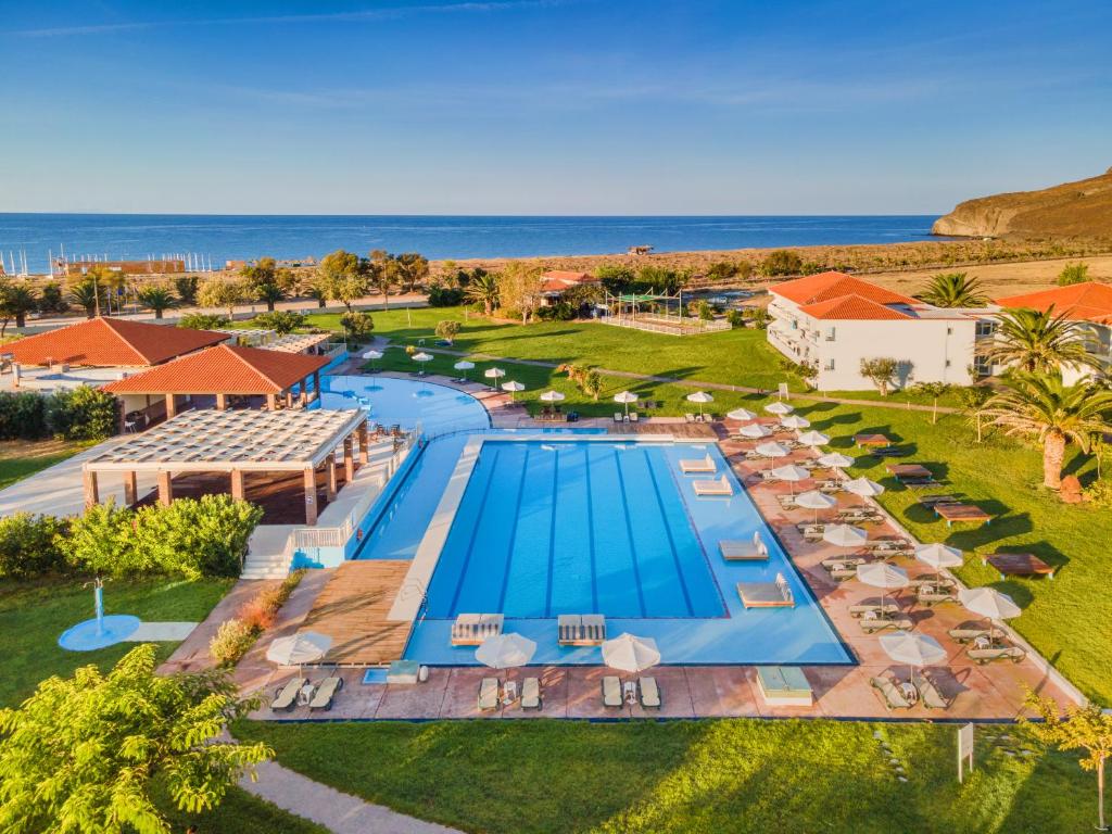 an overhead view of a swimming pool at a resort at Aeolian Village Beach Resort in Skala Eresou
